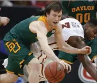  ?? THE ASSOCIATED PRESS FILE PHOTO ?? Brady Heslip, left, who had an all-star college career at Baylor, has impressed Raptors coach Dwayne Casey with his threes.