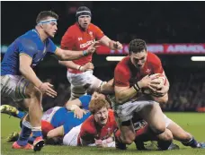  ??  ?? George North, right, shook off poor club form to score two tries that set up victory over Italy with a bonus point