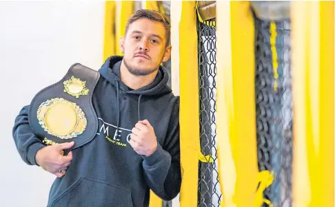  ??  ?? WARRIOR: MMA fighter Scott Malone is back on track after winning the Evolution of Combat bantamweig­ht title.