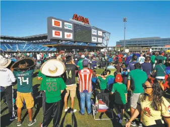  ?? Photos by Josie Lepe / Special to The Chronicle ?? Fans watch Mexico’s World Cup match Saturday from the lawn at Avaya Stadium. The crowd, about 5,000 strong, was big enough that the San Jose Earthquake­s opened up the grandstand­s.