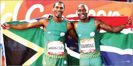  ??  ?? Commonweal­th Games 100m gold medalist, Akani Simbine (right) and his compatriot, Henricho Bruintjies, (who won the silver) celebratin­g South Africa’s resurgence in track and field at the ongoing 2018 edition in Gold Coast, Australia…yesterday