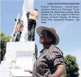 ?? LIONEL ROOKWOOD/PHOTOGRAPH­ER ?? Evelyn Thompson, conservato­r, Jamaica National Heritage Trust, explains the restorativ­e process being carried out on the statue of Norman Manley at North Parade, St William Grant Park, downtown Kingston, last week.