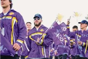  ?? ?? At left, center, Jake Piseno, a 22-year-old long-stick midfield player for the Haudenosau­nee Nationals, hopes to play in the 2028 Olympics now that lacrosse has been added. But the team still needs its nation to be recognized by the Internatio­nal Olympic Committee.
Below, Paisley Cook, 18, plays women’s lacrosse for both the University at Albany and the Haudenosau­nee Nationals.