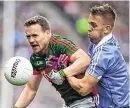  ??  ?? Dublin’s Jonny Cooper making life difficult for Mayo’s Andy Moran in 2016