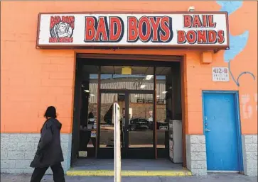  ?? Gary Coronado Los Angeles Times ?? THE BAIL-BOND industry has been characteri­zed by small storefront shops. But since the recession, private-equity firms have invested in firms that serve the poor, such as Endeavour Capital’s investment in Triton.