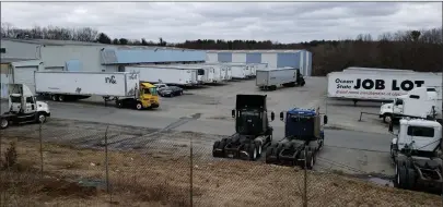  ?? Photo by Joseph B. Nadeau ?? Pictured, semi trucks come and go at a depot in North Smithfield on Monday. Truckers in Rhode Island and throughout the country are mobilizing to keep up with massive spikes in demand at retailers and grocery stores due to the impact of coronaviru­s.