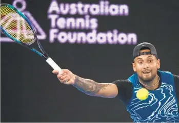  ?? MARK BAKER AP ?? Australia’s Nick Kyrgios plays a forehand to Serbia’s Novak Djokovic during an exhibition match Friday.