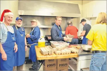  ?? KIRK STARRATT ?? Several members of the Kingston Lions Club volunteere­d to work in the kitchen for the annual Christmas Eve breakfast.