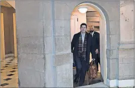  ?? [SUSAN WALSH/THE ASSOCIATED PRESS] ?? House Speaker Paul Ryan of Wisconsin walks up a stairwell to his office on Capitol Hill prior to a meeting Wednesday with congressio­nal leaders and White House officials.