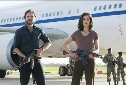  ?? FOCUS FEATURES ?? The newest version of 7 Days in Entebbe — the fourth time it’s been told on screen — features Daniel Brühl, left, and Rosamund Pike.