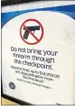  ?? MEDIANEWS GROUP FILE PHOTO ?? A sign warns travelers not to bring weapons through the TSA checkpoint at Philadelph­ia Internatio­nal Airport.