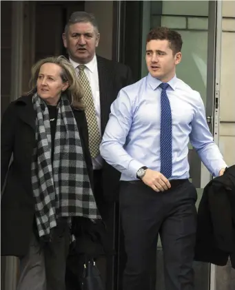  ??  ?? Ireland and Ulster rugby player Paddy Jackson (far right) leaving Belfast Crown Court.