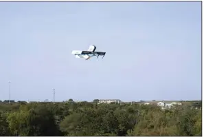  ?? (AP/Amazon) ?? An Amazon drone delivers presciptio­n drugs near College Station, Texas.