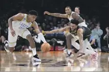  ?? Marcio Jose Sanchez Associated Press ?? RUI HACHIMURA recovers a loose ball against Nickeil Alexander-Walker and the Timberwolv­es in Friday night’s loss.