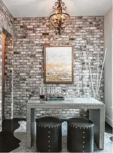  ??  ?? A wine-tasting room gets a brick-veneer wall treatment.