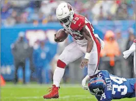  ?? [ADAM HUNGER/THE ASSOCIATED PRESS] ?? The Cardinals’ Chase Edmonds runs the ball during last Sunday’s game against the Giants in East Rutherford, N.J.