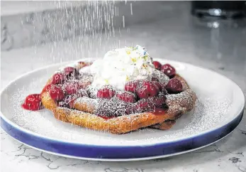  ?? ?? A funnel cake can be topped off with a wide variety of toppings, including pie filling, whipped cream and sprinkles.