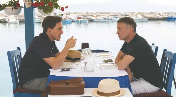  ?? PHOTOS: ELEVATION PICTURES ?? Actors Rob Brydon, left, and Steve Coogan are sharing laughs and fine meals once again in The Trip to Greece.