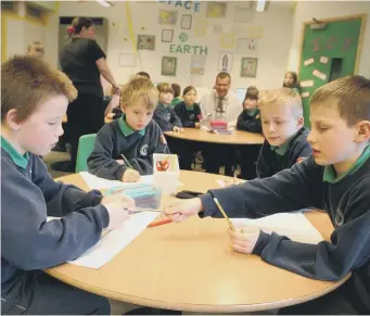  ??  ?? Hard at work again, pupils from Valley Road Primary School in 2004.