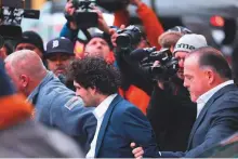  ?? AFP ?? FTX founder Sam Bankman-Fried leaves Manhattan Federal Court after his arraignmen­t and bail hearings on Thursday in New York City.