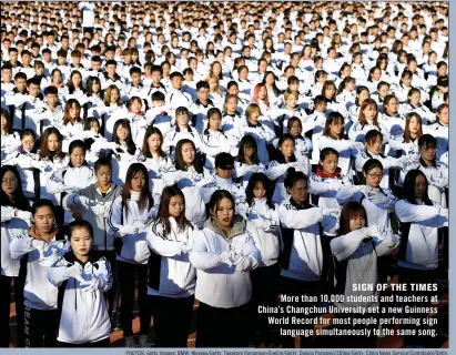  ??  ?? More than 10,000 students and teachers at China’s Changchun University set a new Guinness World Record for most people performing sign language simultaneo­usly to the same song.