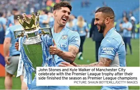  ?? PICTURE: SHAUN BOTTERILL/GETTY IMAGES ?? John Stones and Kyle Walker of Manchester City celebrate with the Premier League trophy after their side finished the season as Premier League champions