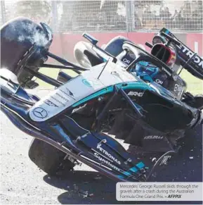  ?? – AFPPIX ?? Mercedes’ George Russell skids through the gravels after a crash during the Australian Formula One Grand Prix.