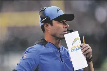  ?? MATT ROURKE/AP ?? LOS ANGELES CHARGERS HEAD COACH BRANDON STALEY watches action during the first half of a game against the Philadelph­ia Eagles on Nov. 7 in Philadelph­ia.