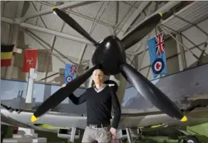  ??  ?? Nick Godwin, head of documentar­ies at Cineflix, poses with a Spitfire at the Canadian Warplane Heritage Museum that was used in the series Air Aces. The plane is on loan to the museum.