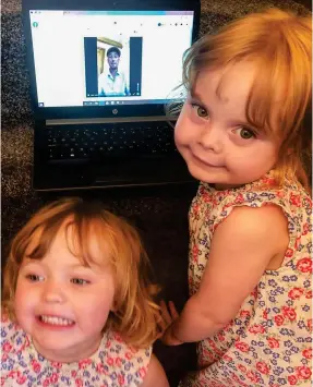  ??  ?? Tell us a tale: Poppy-Rose and Skyla-Rae listen to grandad’s story