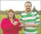  ??  ?? Lorna Wylie presents Neil Carmichael with the man of the match quaich.