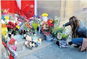  ??  ?? Fans leave tributes outside the Lounge in Warrington where the band played
