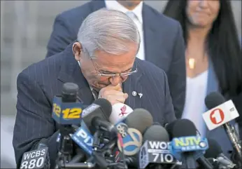  ?? Julio Cortez/Associated Press ?? U.S. Sen. Bob Menendez fights tears as he speaks to reporters outside Martin Luther King Jr. Federal Courthouse after U.S. District Judge William Walls declared a mistrial in Menendez’s federal corruption trial Thursday in Newark, N.J.