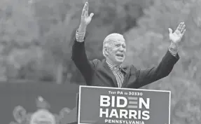  ?? ANDREW HARNIK/AP ?? Democratic presidenti­al candidate Joe Biden speaks at a drive-in campaign stop in Bristol, Pennsylvan­ia on Saturday.
