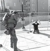  ?? HELEN H. RICHARDSON/DENVER POST ?? A man identified by The Denver Post as Matthew Dolloff, 30, is taken into custody after a fatal shooting Saturday.