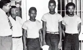  ?? Florida Memory Project ?? Lake County Sheriff Willis McCall, far left, and an unidentifi­ed man stand next to Walter Irvin, Samuel Shepherd, and Charles Greenlee.