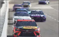  ?? James Gilbert / Getty Images ?? Martin Truex Jr. leads the field during the NASCAR Cup Series Blue-Emu Maximum Pain Relief 500 at Martinsvil­le Speedway on Sunday in Martinsvil­le, Va.