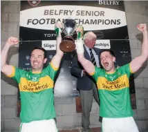  ??  ?? John Marren and James Leonard celebrate with the trophy.