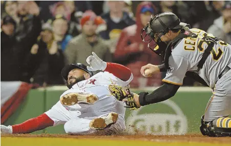  ?? STAFF PHOTOS BY CHRISTOPHE­R EVANS ?? DOWN AND OUT: Sandy Leon is caught by Pirates catcher Francisco Cervelli trying to score during the third inning of last night’s game at Fenway; at right, reliever Joe Kelly fires a pitch during the eighth inning of the Red Sox’ 3-0 victory.