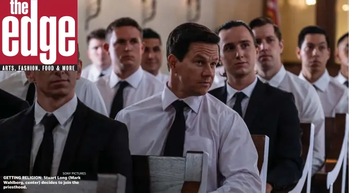  ?? SONY PICTURES ?? GETTING RELIGION: Stuart Long (Mark Wahlberg, center) decides to join the priesthood.