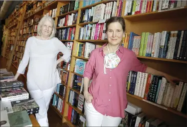  ?? THE ASSOCIATED PRESS ?? Novelist Ann Patchett, right, and her business partner, Karen Hayes, in their independen­t bookstore, Parnassus Books, in Nashville, Tenn. Their bookstore that opened and thrived while others were closing their doors is once again defying the odds during the coronaviru­s pandemic.