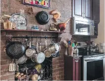  ??  ?? The kitchen has had some of the brickwork exposed.