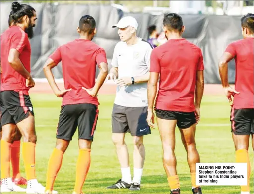  ??  ?? MAKING HIS POINT: Stephen Constantin­e talks to his India players at training