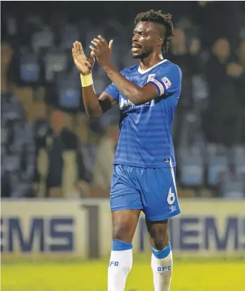  ?? PICTURE: KM MEDIA ?? Gaby Zakuani applauds the Gillingham fans.