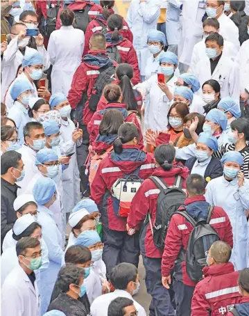  ?? Photo: Xinhua/Jiang Kehong ?? Medical team members say goodbye to their colleagues when leaving for Yichang of central China’s Hubei Province, in Fuzhou, southeast China’s Fujian Province, on February 11, 2020. A 158-member medical team of Fujian Province departed on Tuesday for Yichang, central China’s Hubei Province to aid the novel coronaviru­s control efforts there.