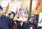  ?? AFP ?? People demonstrat­e in front of the office of Standard & Poor’s in Paris. The agency downgraded France.