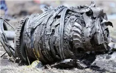  ??  ?? File photo shows the plane engine parts at the scene of the Ethiopian Airlines Flight ET 302 plane crash, near the town of Bishoftu, southeast of Addis Ababa, Ethiopia. — Reuters photo