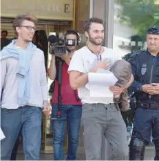  ?? — AFP ?? Swiss-belgian Theo Buckmaster (R) and Swiss Bastien Stauffer (L) leave the courthouse in Gap, in the French Alpes, after a hearing on Thursday.