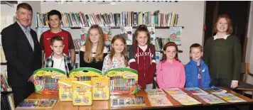  ??  ?? The winners in the schools colouring competitio­n organised by Georgina O’Gorman (right) pictured at Charlevill­e Library with Ian Doyle, chairman Heriitage Society.