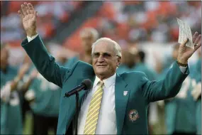  ?? JEFFREY M. BOAN - THE ASSOCIATED PRESS ?? Former Dolphins coach Don Shula waves to the crowd in 2009 during a halftime ceremony in Miami.